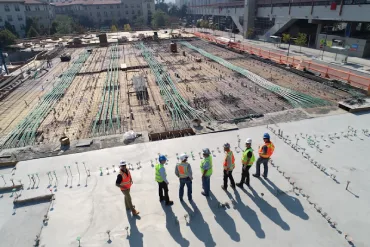 Construction site with cranes and steel framework